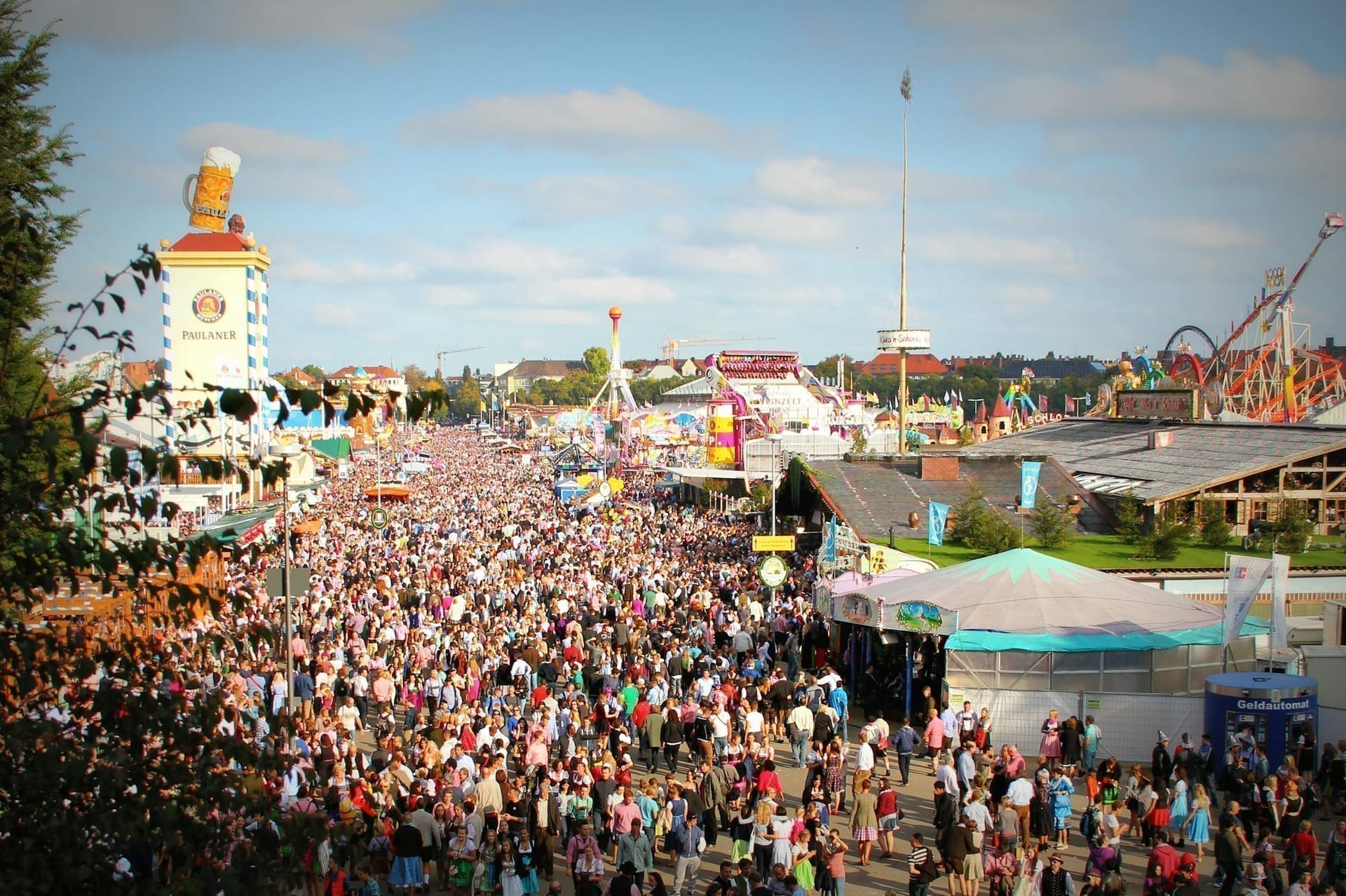 Massive crowd enjoying Oktoberfest festivities and attractions in Munich