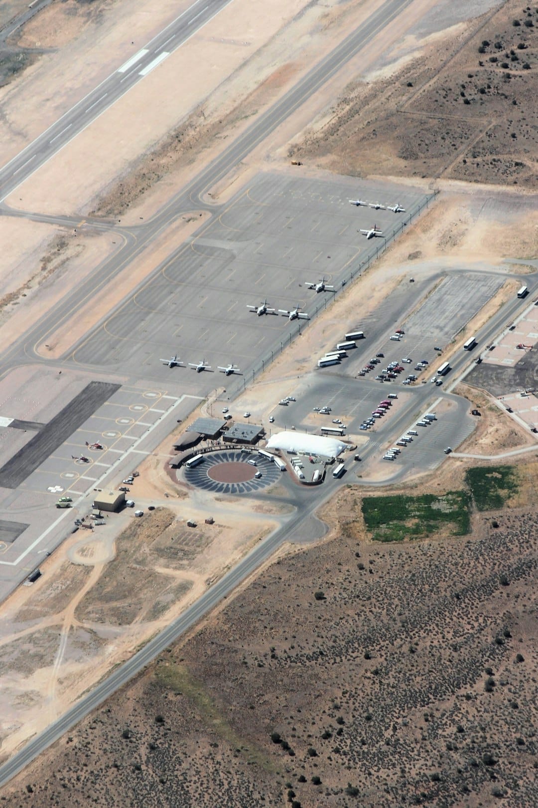 Aircraft hangar interior with mixed fleet of business jets parked in a tight FBO layout, illustrating the need for data-driven placement optimization