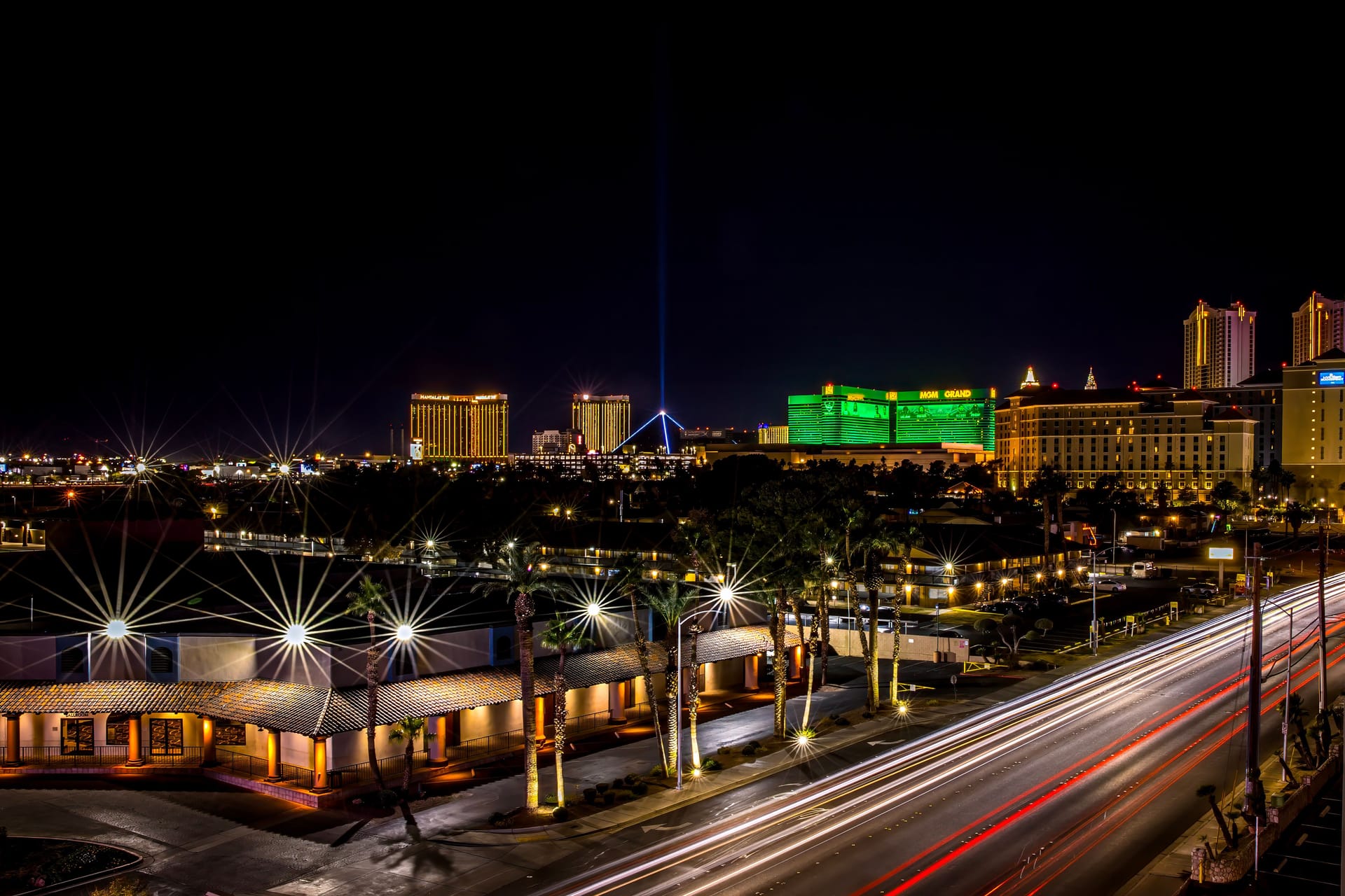 The Las Vegas Strip glowing at night with hotel towers and light trails