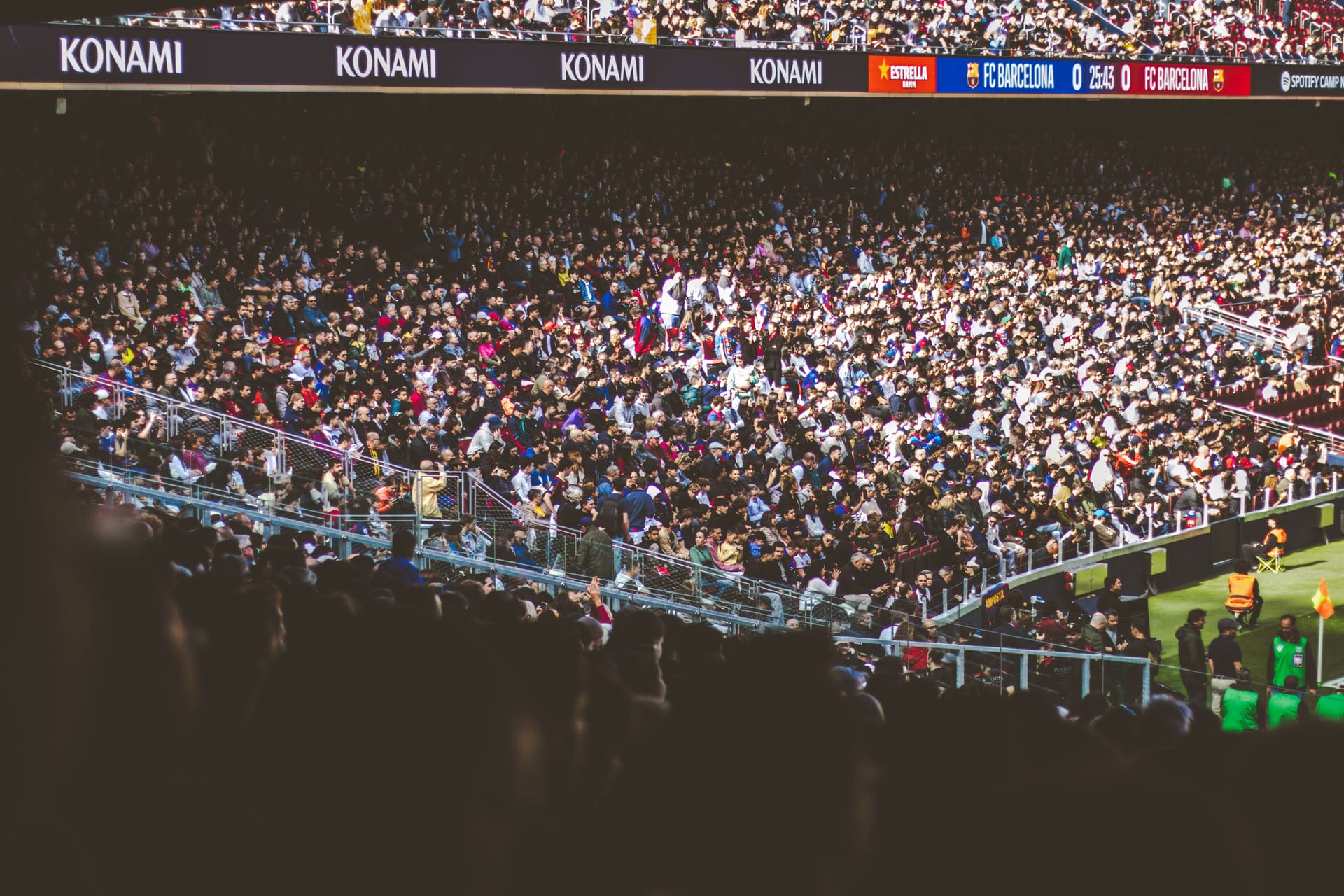 A packed soccer stadium with the stands full of fans during a match