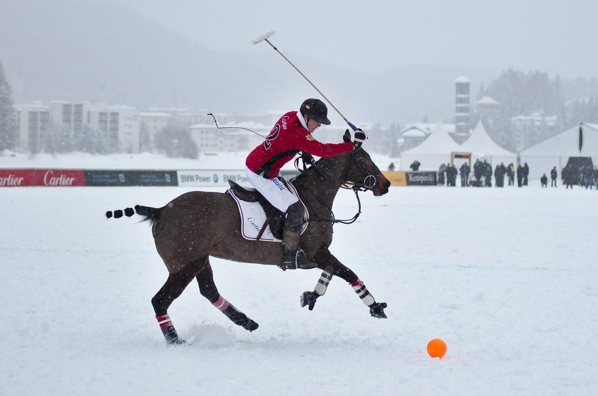 Snow polo match at St. Moritz Polo World Cup on frozen lake