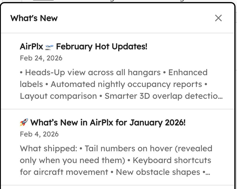 What's New popover with announcement cards and an unseen dot
